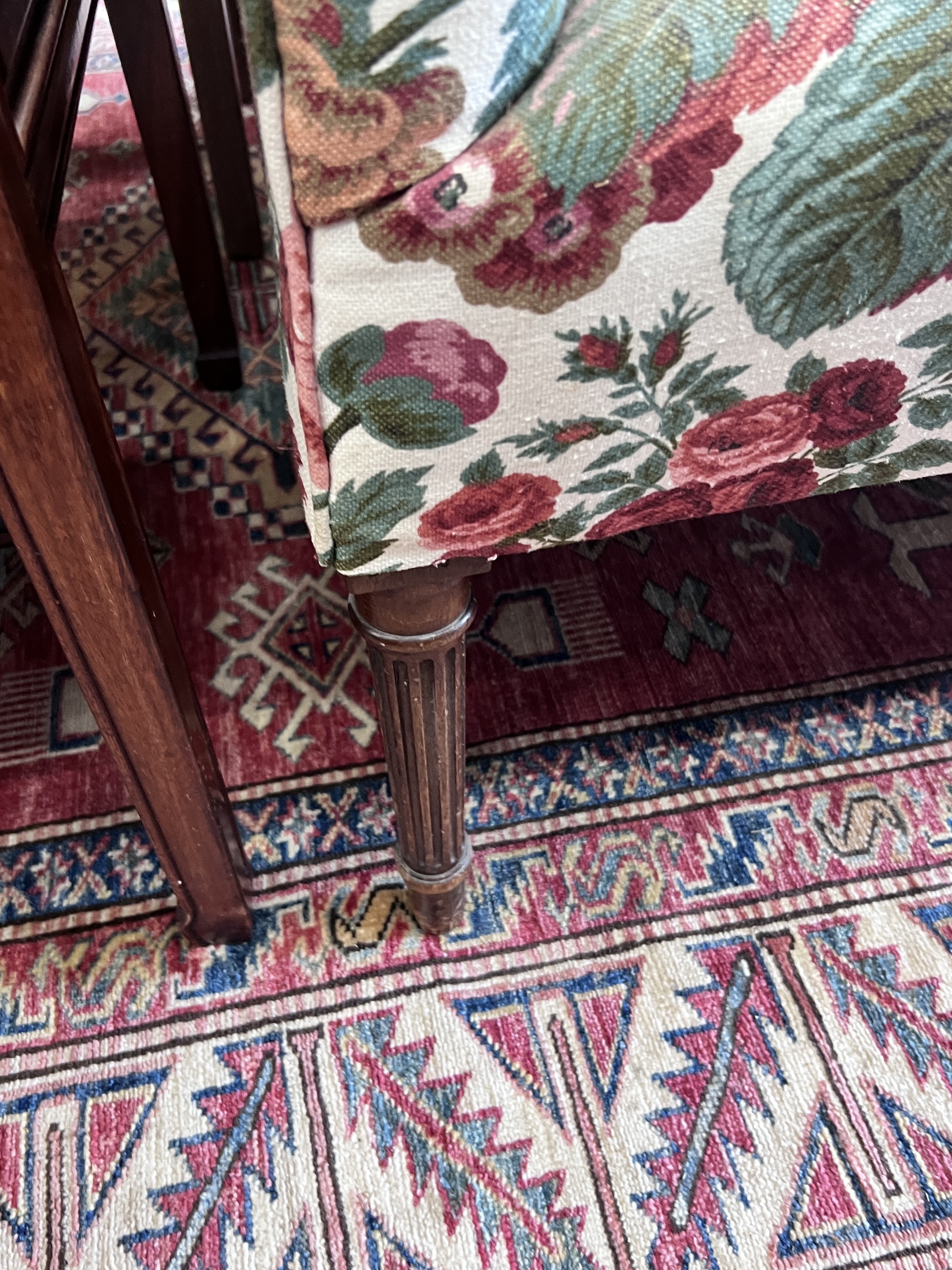 A small Victorian style floral fabric settee, length 128cm, depth 59cm, height 90cm